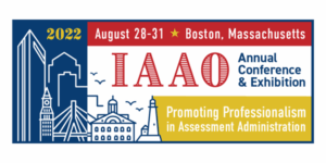 Illustration of Boston skyline in simple line art within a wide rectangle of red, white, blue, and gold. Text reads: "August 28-31, 2022. Boston, Massachusetts. IAAO Annual Conference & Exhibition. Promoting Professionalism in Assessment Administration."