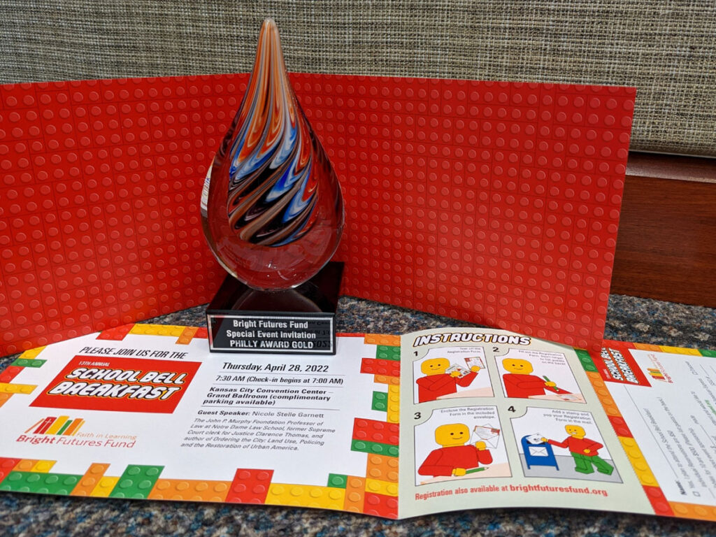 Photo of Bright Futures Fund Gold Philly-Winning fundraiser brochure. It has a lego theme and is very colorful.